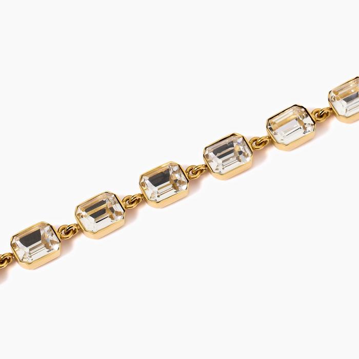 Bracciale dorato con cristalli bianchi