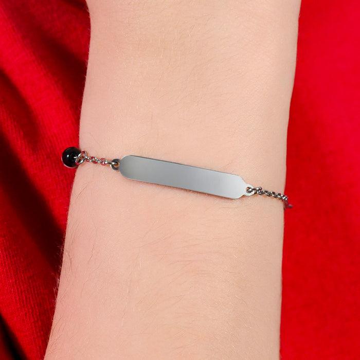 BRACCIALE BAMBINO IN ACCIAIO CON PIETRE BIANCHE E NERE