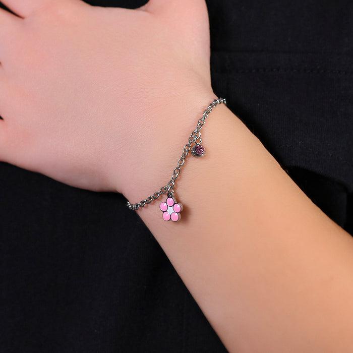 BRACELET FILLE EN ACIER AVEC FLEUR EN ÉMAIL ROSE ET BLANC ET CRISTAL