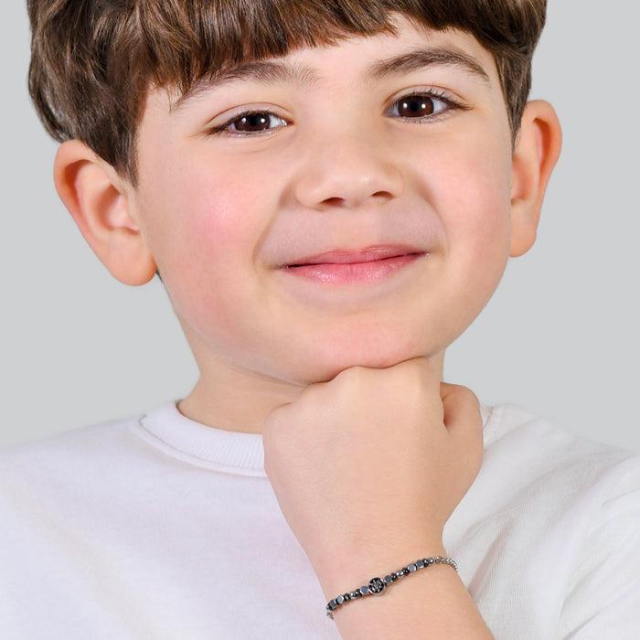 BRACCIALE BAMBINO IN ACCIAIO CON EMATITE GRIGIA E TIMONE