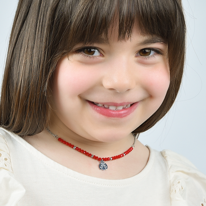 COLLIER FILLE EN ACIER AVEC PIERRES ROUGES ET COCCINELLE