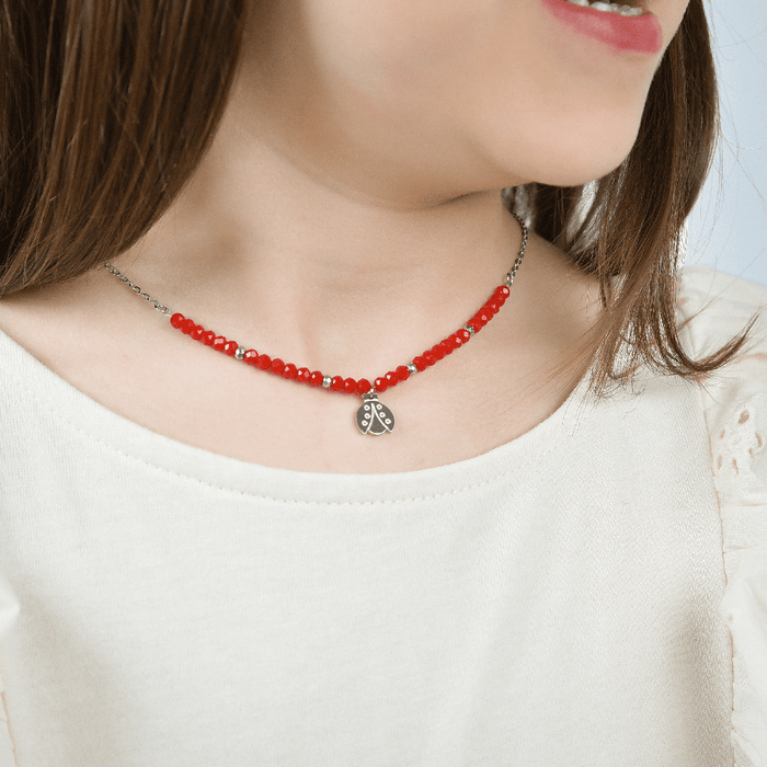 COLLIER FILLE EN ACIER AVEC PIERRES ROUGES ET COCCINELLE