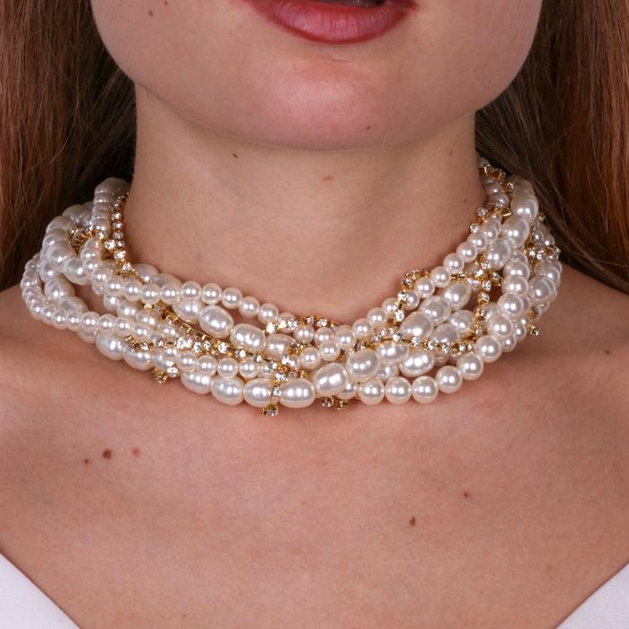 Multi-strand metal necklace woven with pearls and zircons