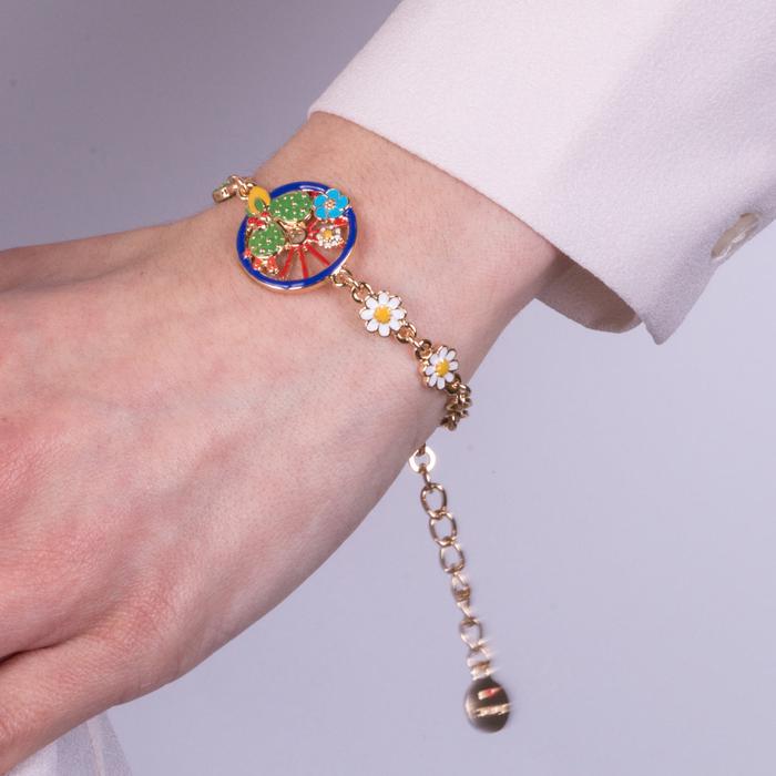 Bracelet en métal avec roue bleue ornée de cactus, citrons et fleurs