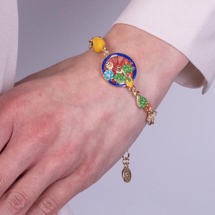 Bracelet en métal avec roue bleue ornée de cactus, citrons et fleurs