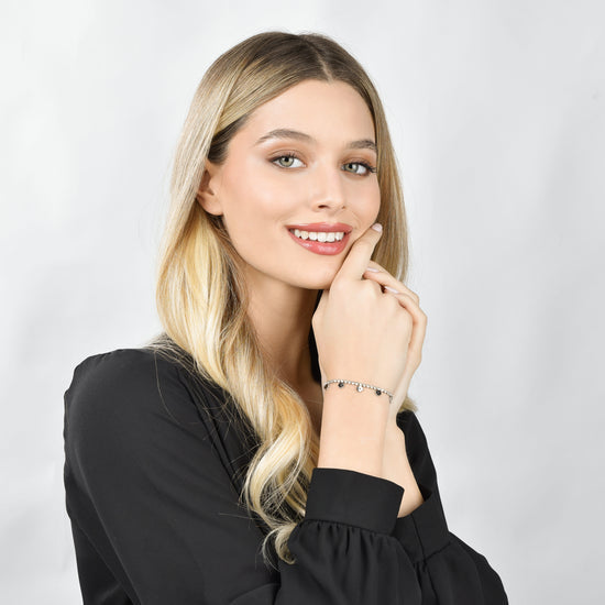 BRACCIALE DONNA IN ACCIAIO CON CRISTALLI BIANCHI E QUADRIFOGLI