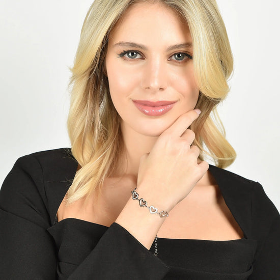 WOMEN'S STEEL BRACELET WITH OPENWORK HEARTS AND WHITE CRYSTALS