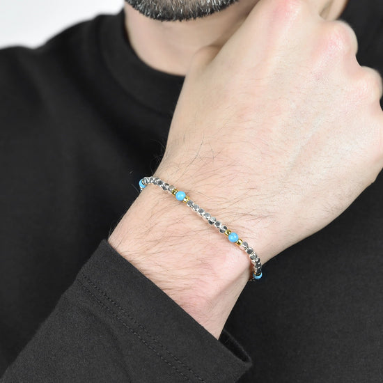 BRACCIALE UOMO IN ACCIAIO CON PIETRE AZZURRE ED ELEMENTI IP GOLD