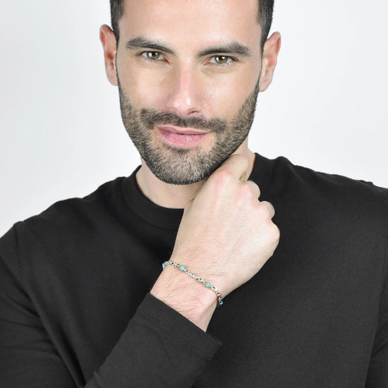 BRACCIALE UOMO IN ACCIAIO CON PIETRE AZZURRE ED ELEMENTI IP GOLD