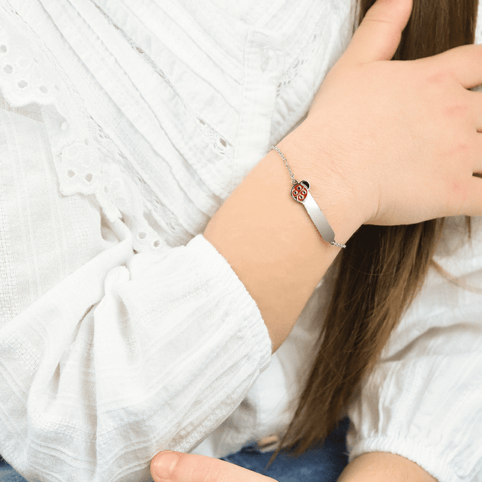 BRACCIALE BAMBINA PERSONALIZZABILE IN ACCIAIO CON COCCINELLA