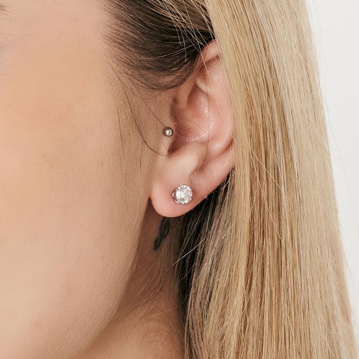 BOUCLE D'OREILLE UNIQUE POINT DE LUMIÈRE EN ACIER AVEC CRISTAL BLANC 3 MM
