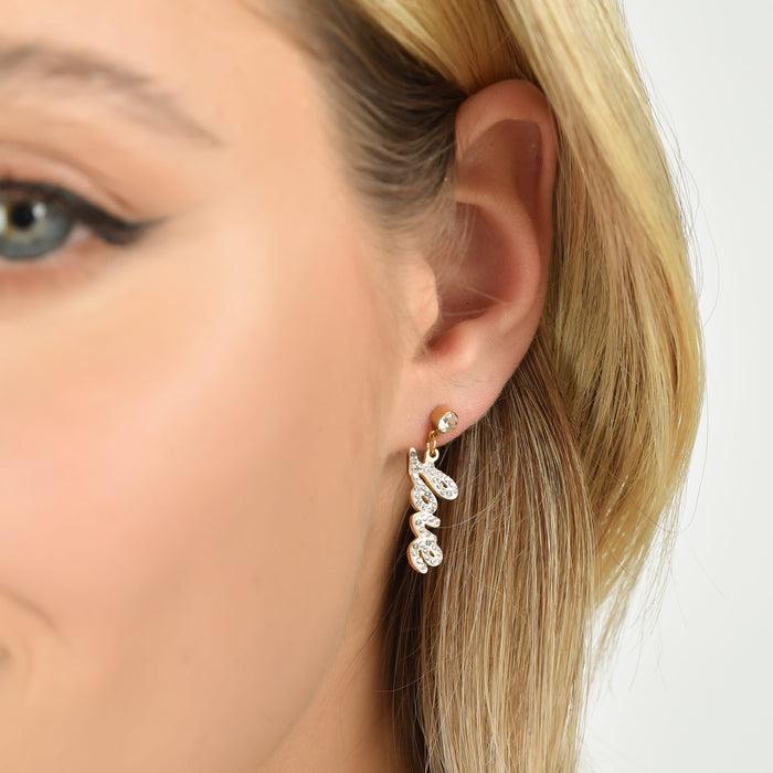 BOUCLES D'OREILLES FEMME EN ACIER DORÉ IP AVEC ÉCRITURE LOVE ET CRISTAUX BLANCS