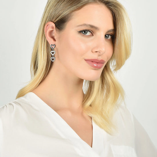 BOUCLES D'OREILLES PENDANTES EN ACIER POUR FEMME AVEC COEURS PERCÉS ET CRISTAUX BLANCS