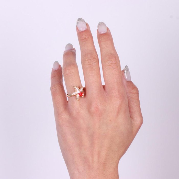 Metal ring with starfish and colored enamels