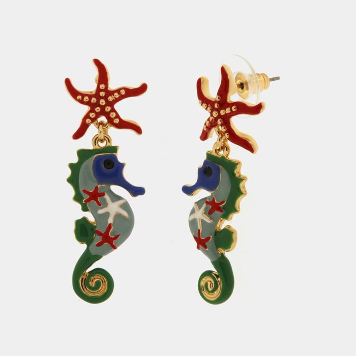 Metal earrings with hanging seahorse