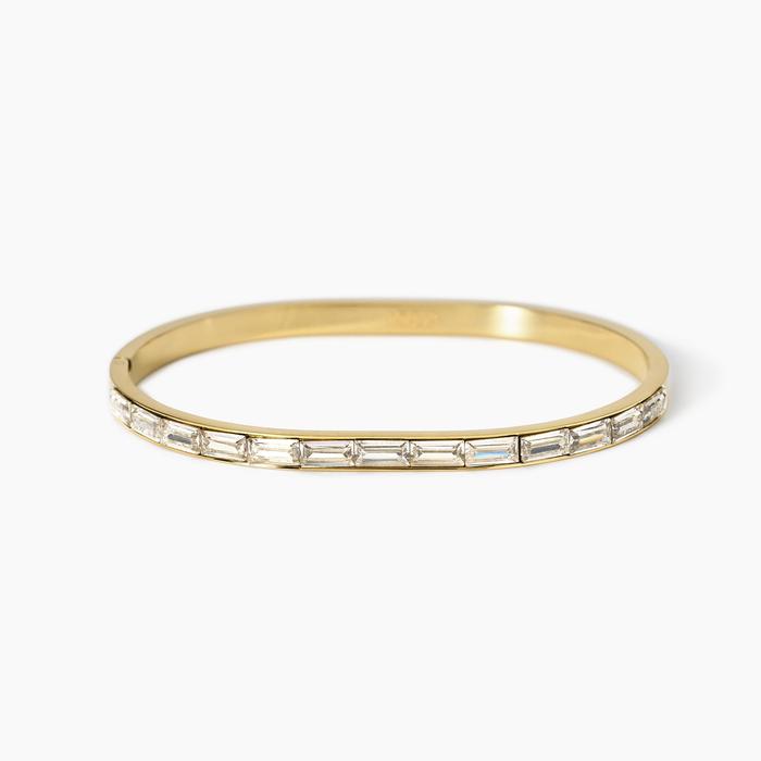 Bracciale rigido in acciaio dorato e zirconi