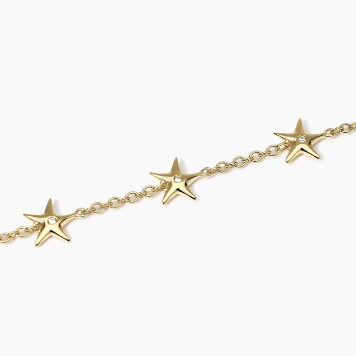 Bracciale dorato con ciondoli stella marina