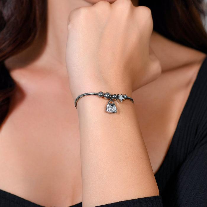 WOMEN'S BRACELET IN STEEL, BAG AND CRYSTALS