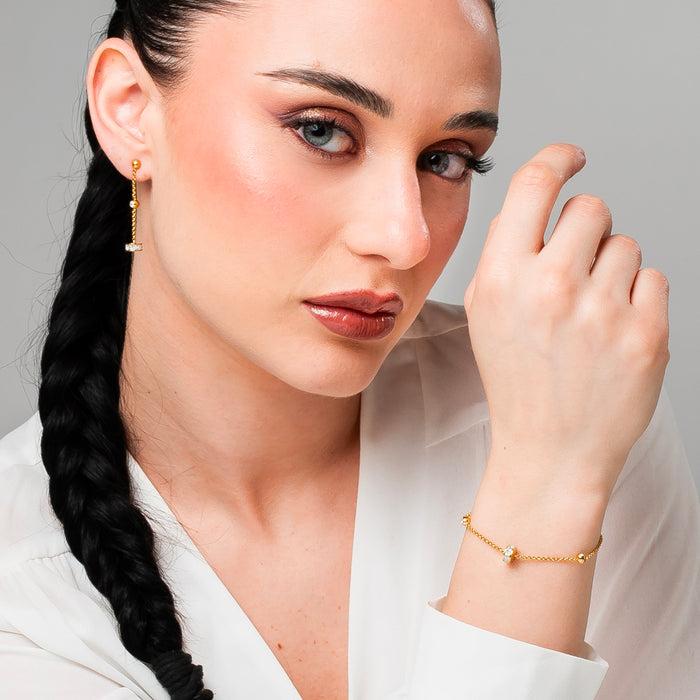 BRACCIALE DONNA IN ACCIAIO IP GOLD, BUSSOLOTTO ED ELEMENTI CON ZIRCONI BIANCHI