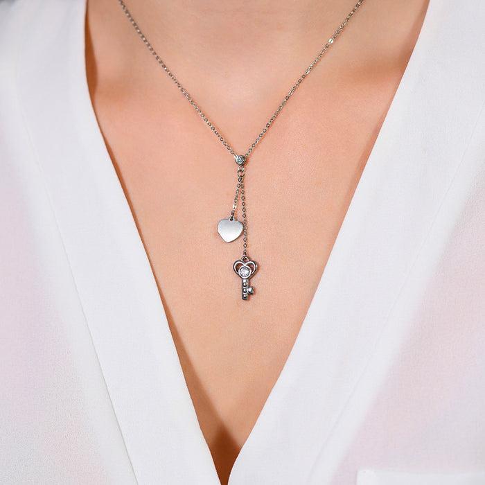 COLLIER FEMME EN ACIER CLÉ ET COEUR
