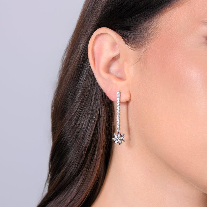 BOUCLES D'OREILLES TENNIS FEMME EN ACIER AVEC FLEUR TOURNANTE