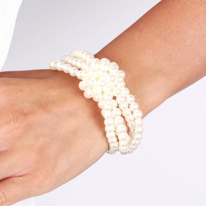 Bracelet en métal avec perles et nœud central