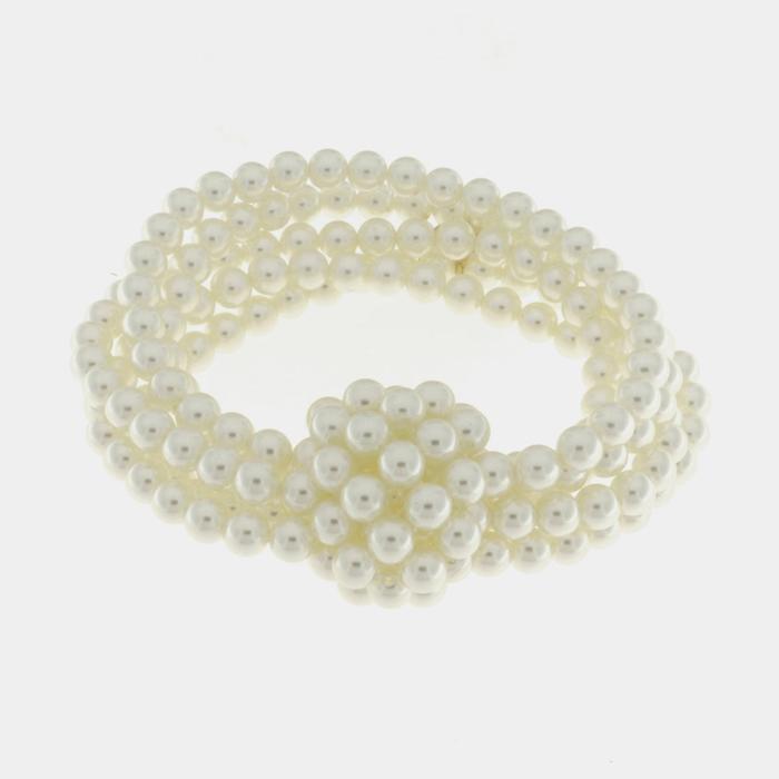 Bracelet en métal avec perles et nœud central