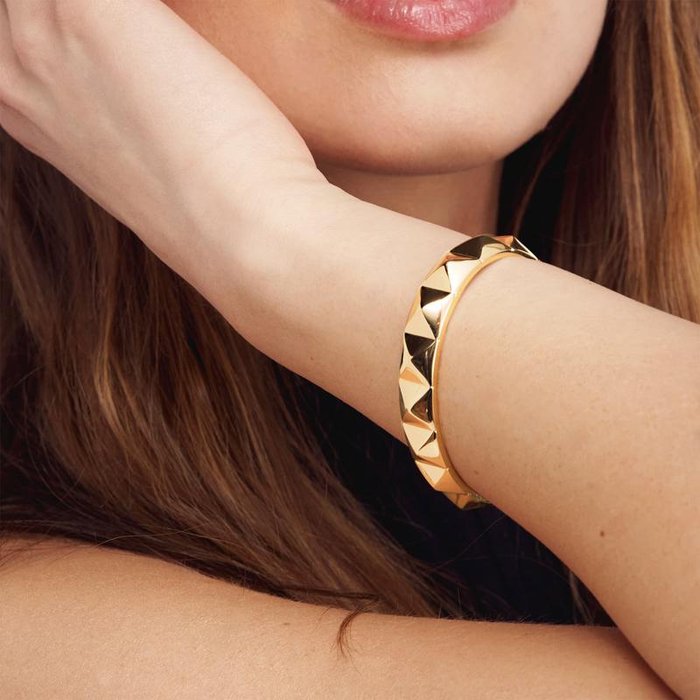 Bracciale rigido in bronzo dorato