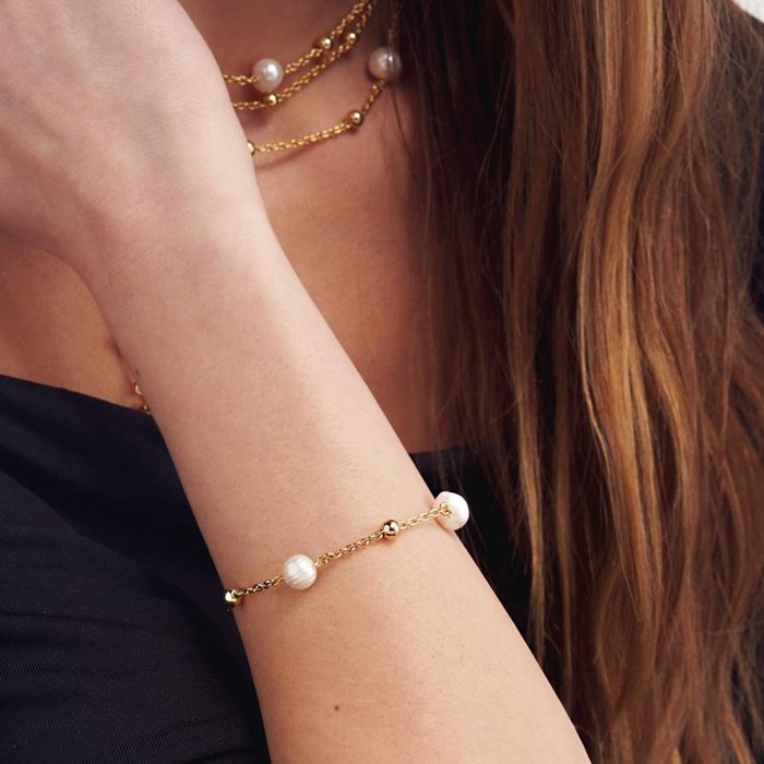 Bracciale in bronzo dorato e perle naturali