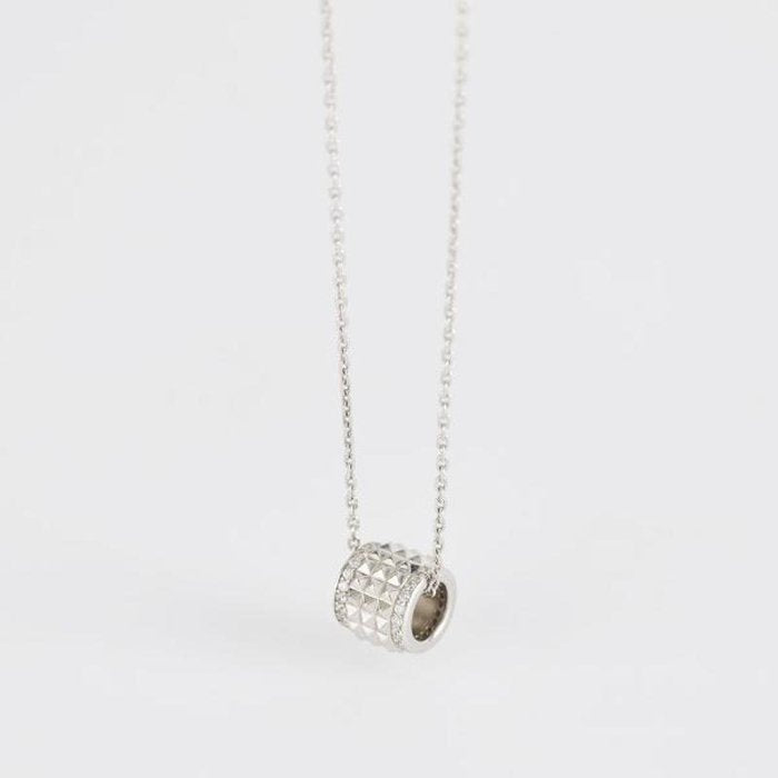 COLLIER AVEC CLOUS CYLINDRIQUES ET ZIRCONE