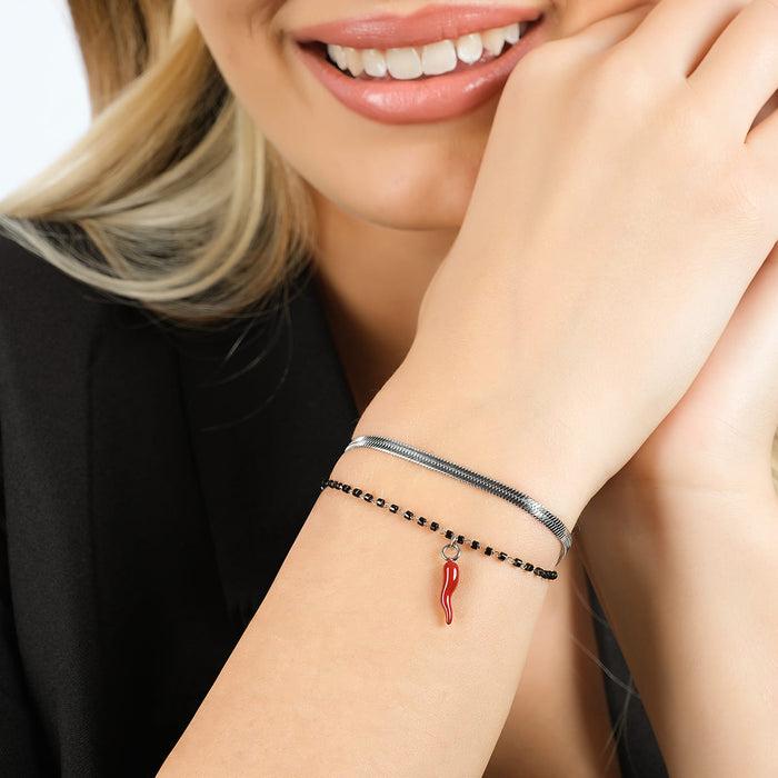 BRACCIALE DONNA IN ACCIAIO CON CORNO CON SMALTO ROSSO ED ELEMENTI NERI