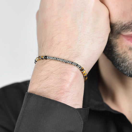 BRACCIALE UOMO IN ACCIAIO CON PIETRE OCCHIO DI TIGRE E SFERE IN ACCIAIO
