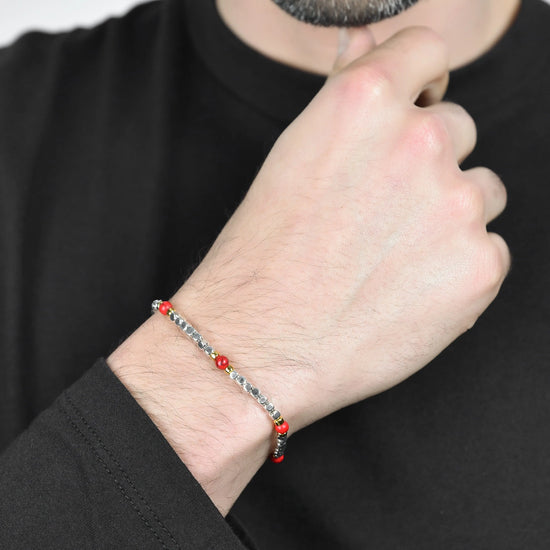 BRACCIALE UOMO IN ACCIAIO CON PIETRE ROSSE ED ELEMENTI IP GOLD