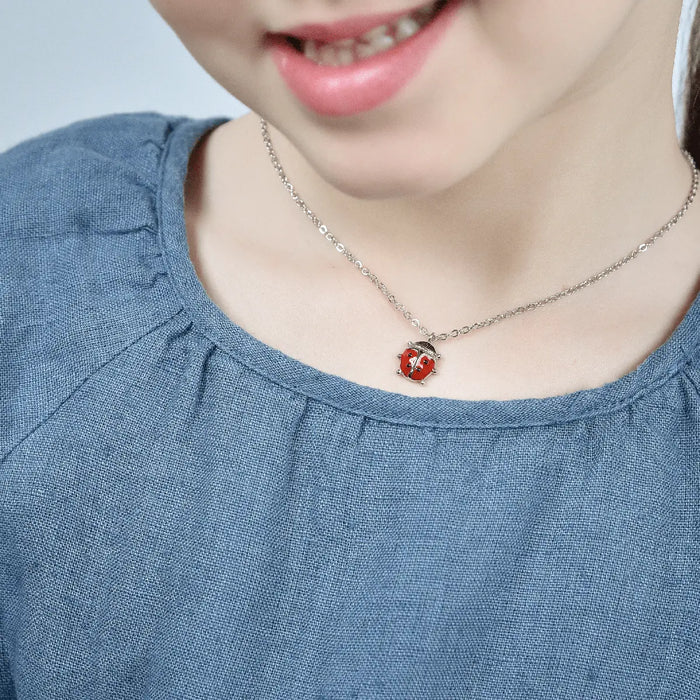 COLLIER EN ACIER POUR ENFANT AVEC COCCINELLE