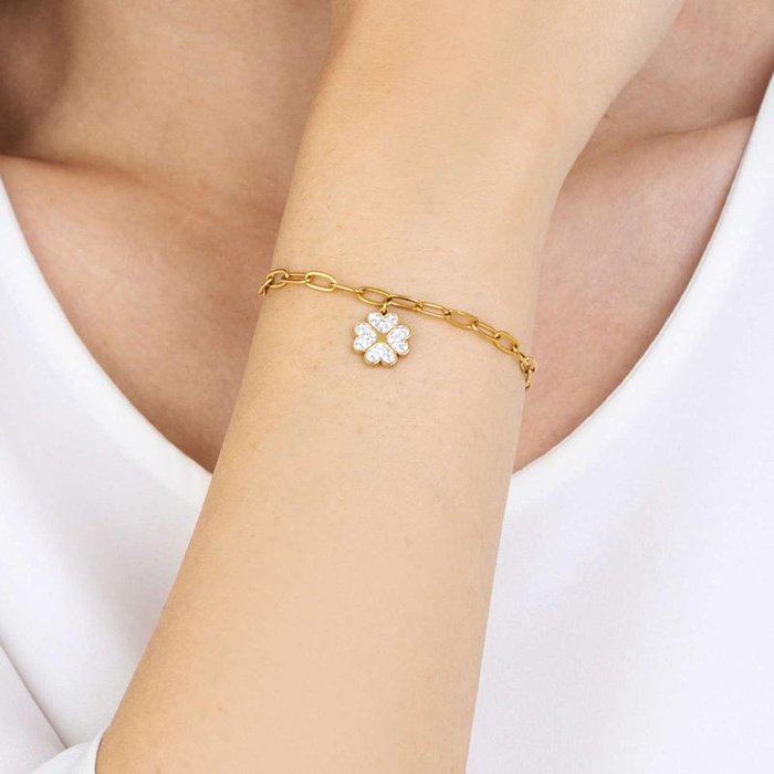 Bracciale in acciaio ip gold con quadrifoglio e cristalli bianchi