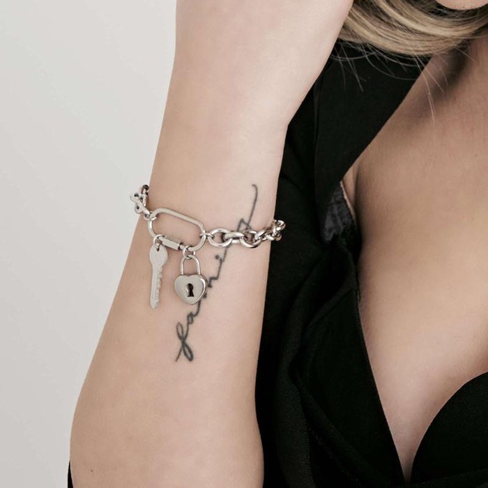 Bracciale in acciaio con chiave e cuore lucchetto
