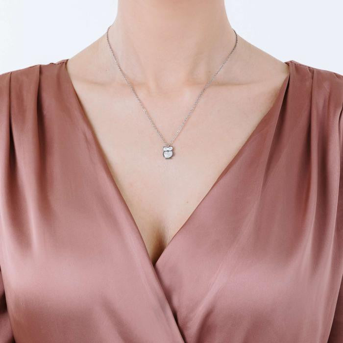 Collier en acier avec hibou et cristaux blancs