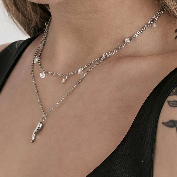 Collana in acciaio con corno e cristalli