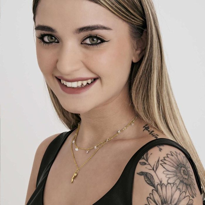 Collana in acciaio ip gold con corno e cristalli