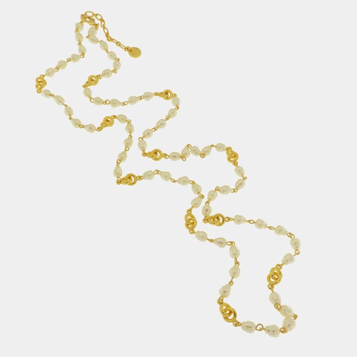 Collier en métal avec perles et symboles entrelacés