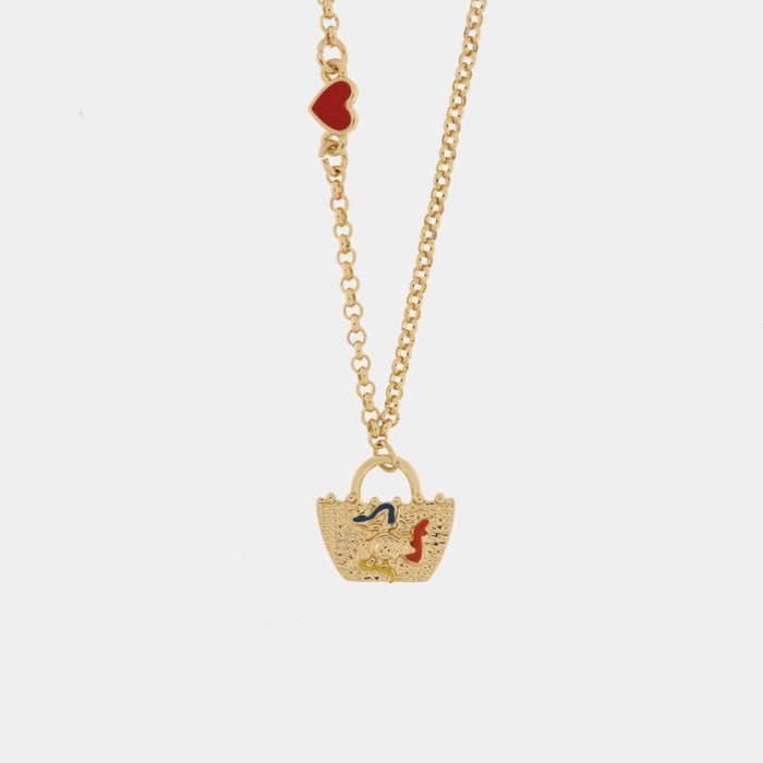 Collier en métal avec sac orné d'une trinacria